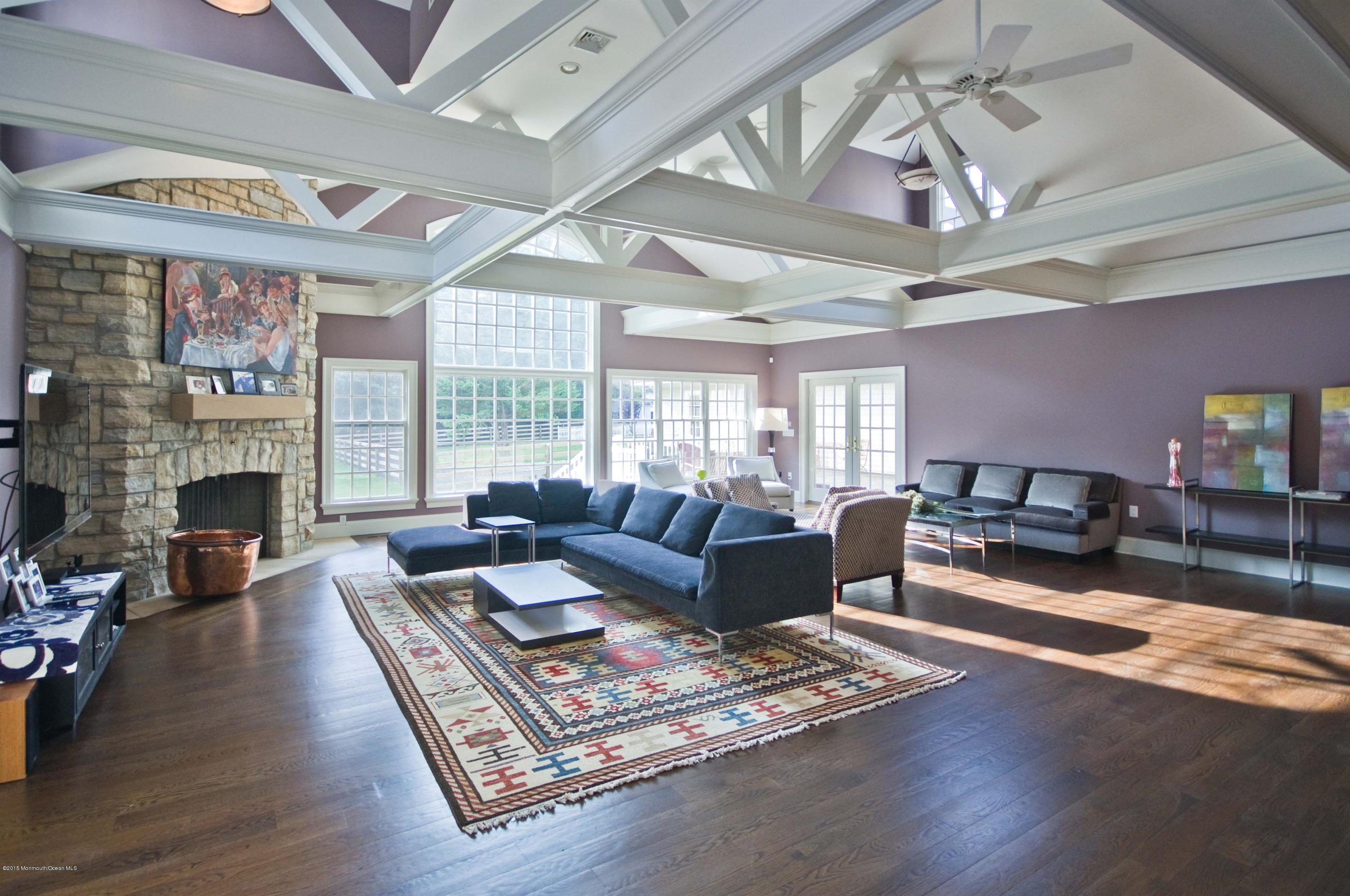 51 Phalanx Road Colts Neck, NJ 07722 - Photo 4 of 35 a living room with furniture fireplace and wooden floor