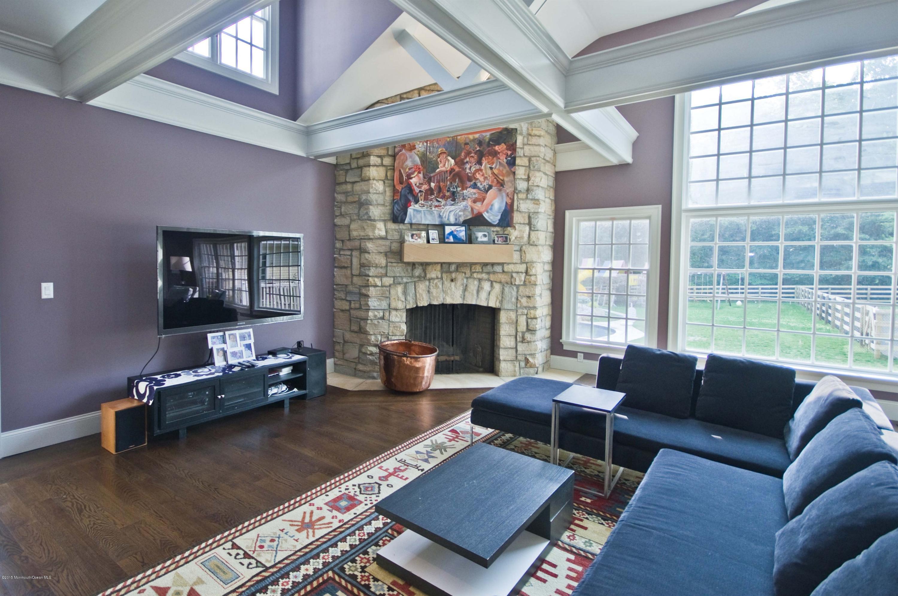 51 Phalanx Road Colts Neck, NJ 07722 - Photo 6 of 35 a living room with furniture and a fireplace