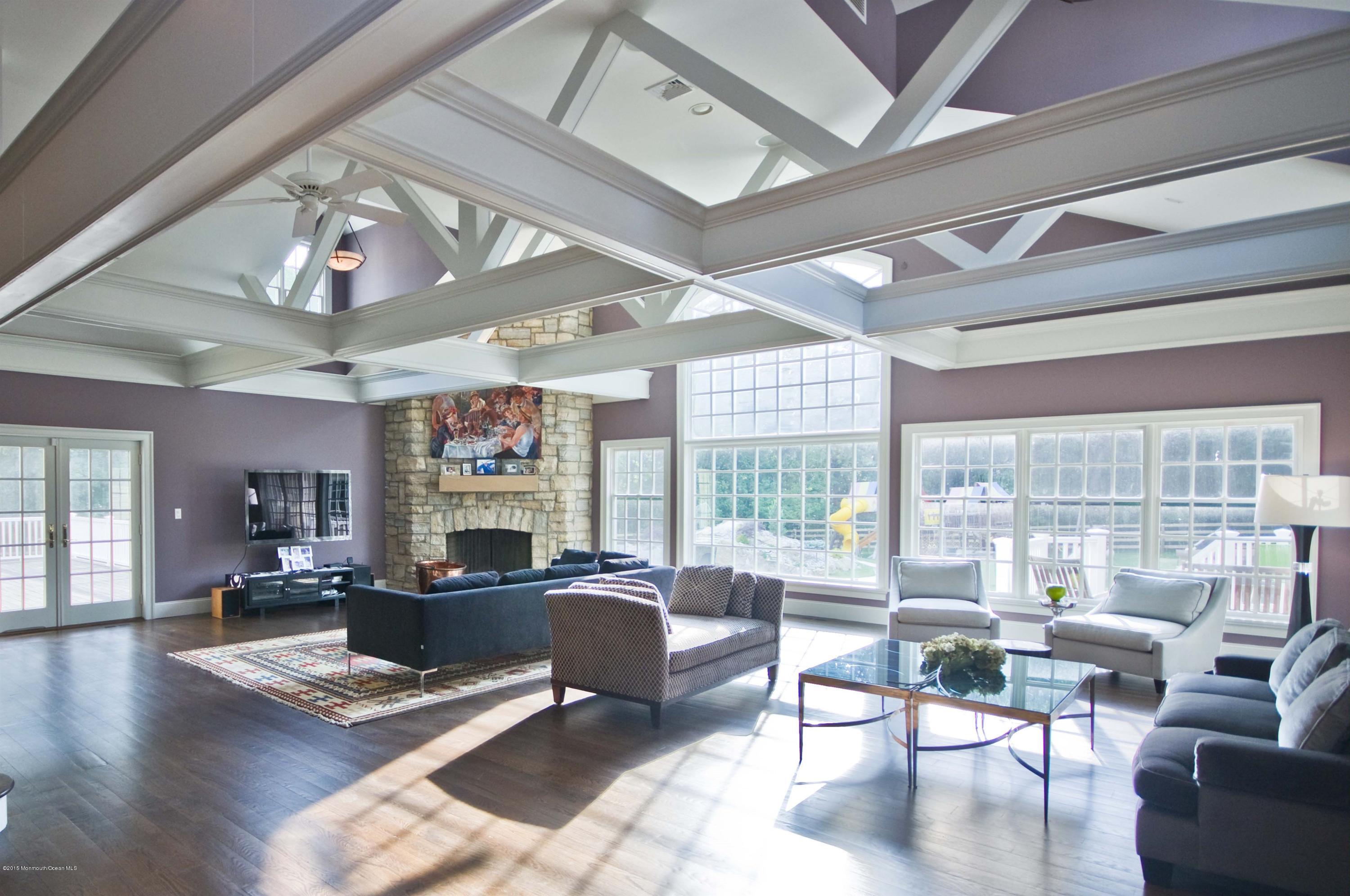 51 Phalanx Road Colts Neck, NJ 07722 - Photo 8 of 35 a living room with fireplace furniture and a large window