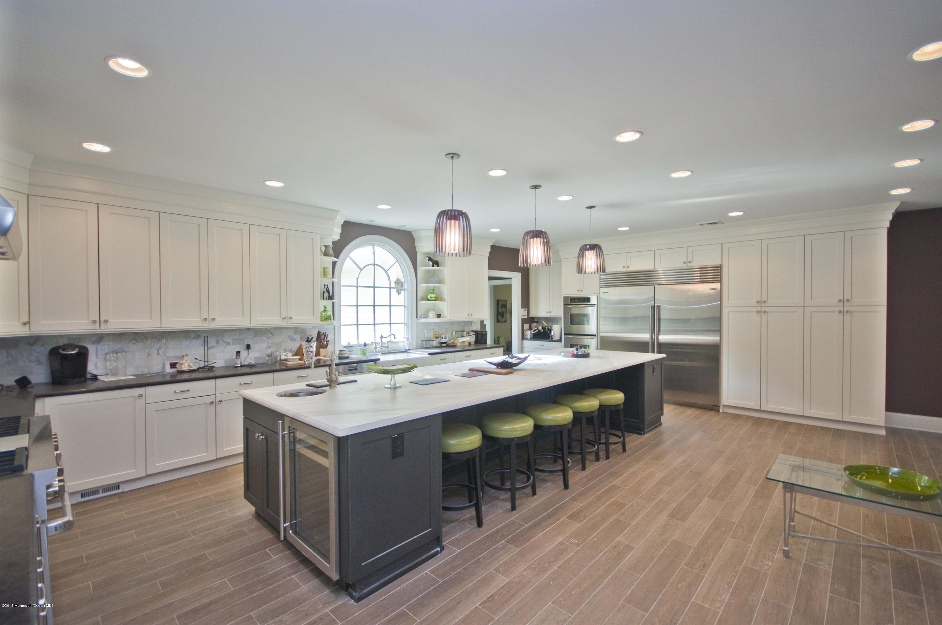 51 Phalanx Road Colts Neck, NJ 07722 - Photo 10 of 35 a large kitchen with kitchen island a sink a stove and a refrigerator
