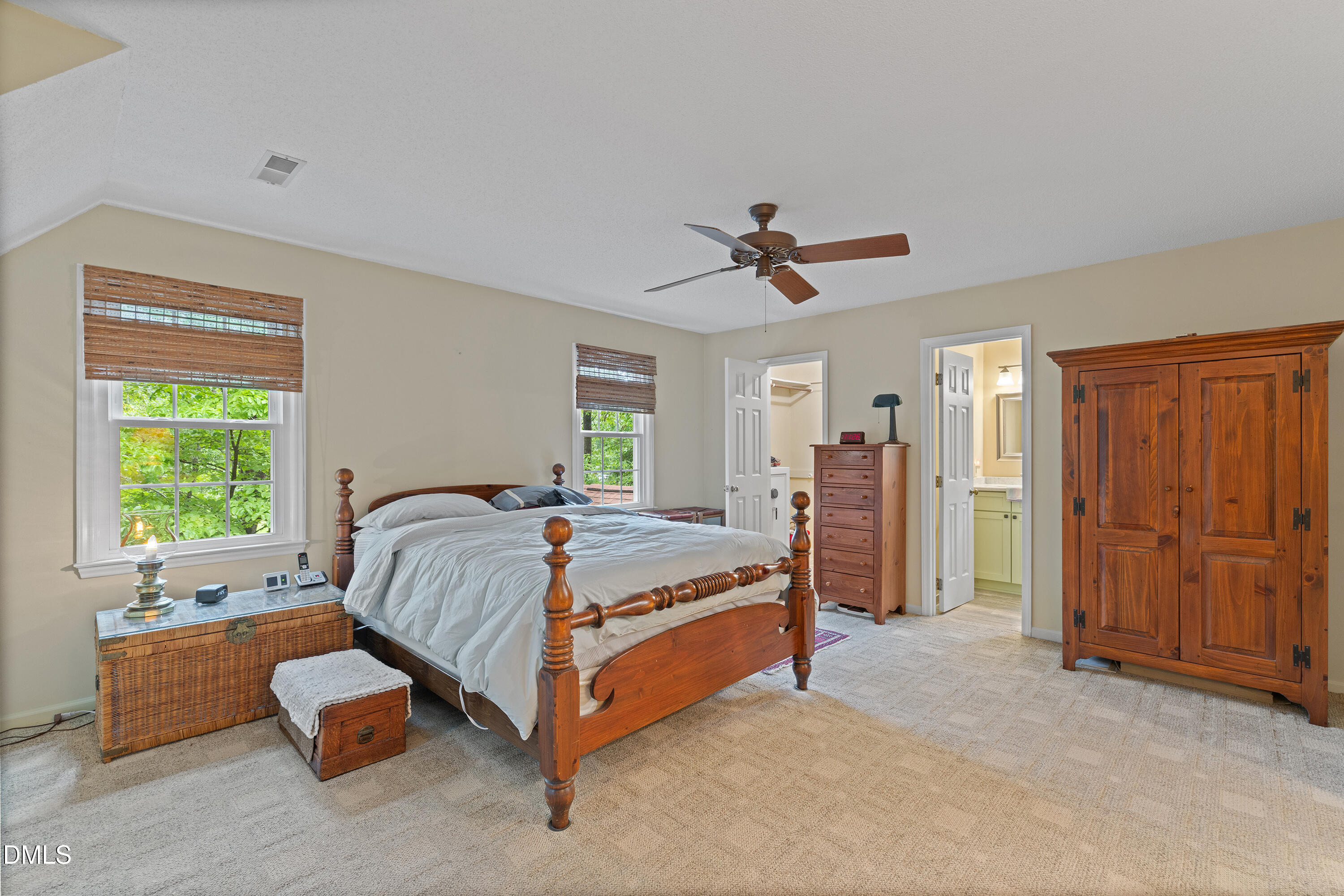 5216 Bridget Drive Raleigh, NC 27603 - Photo 13 of 30 a spacious bedroom with a bed and a chandelier