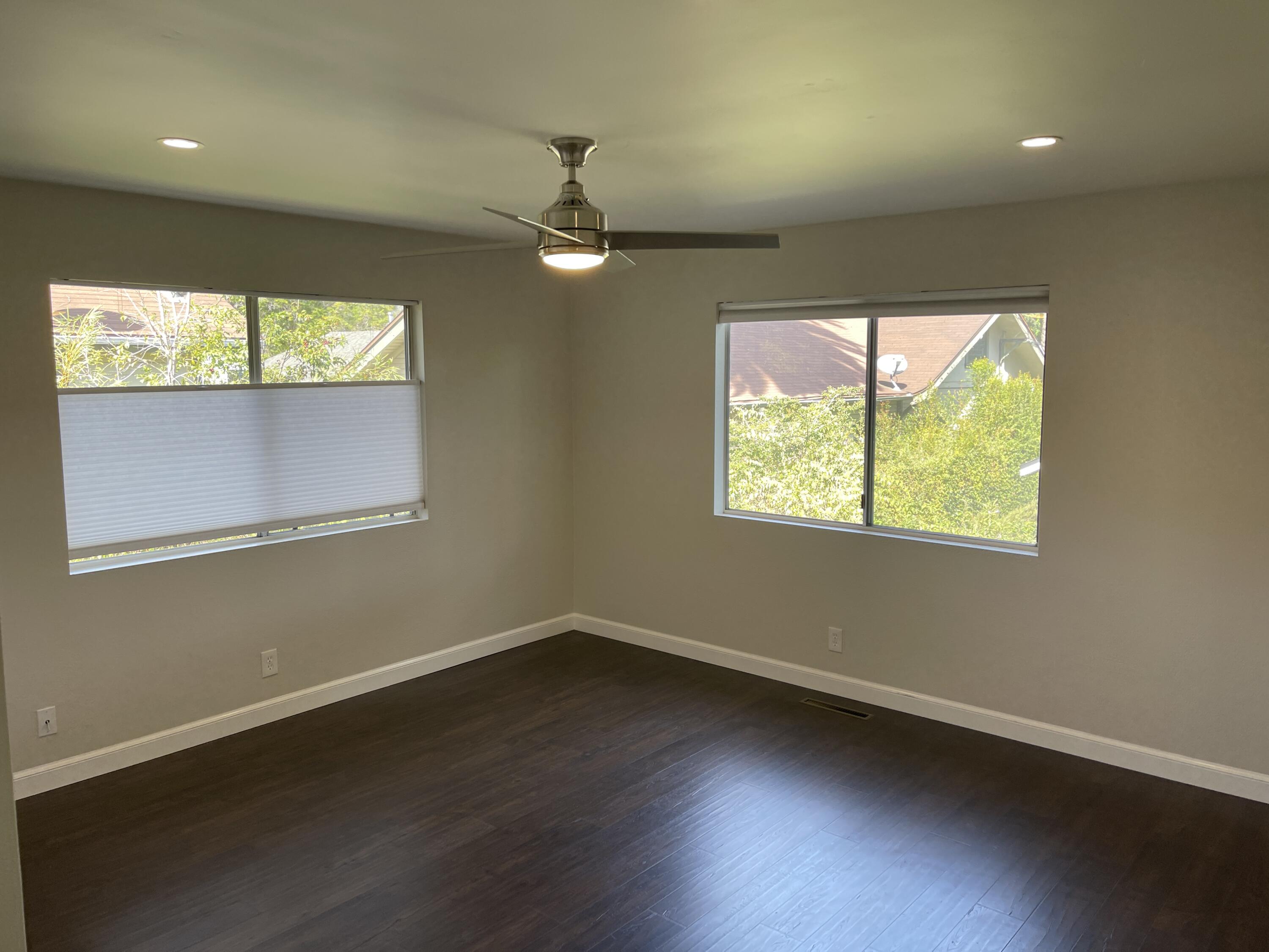 2019 Castillo Street Santa Barbara, CA 93105 - Photo 13 of 24 an empty room with wooden floor and windows