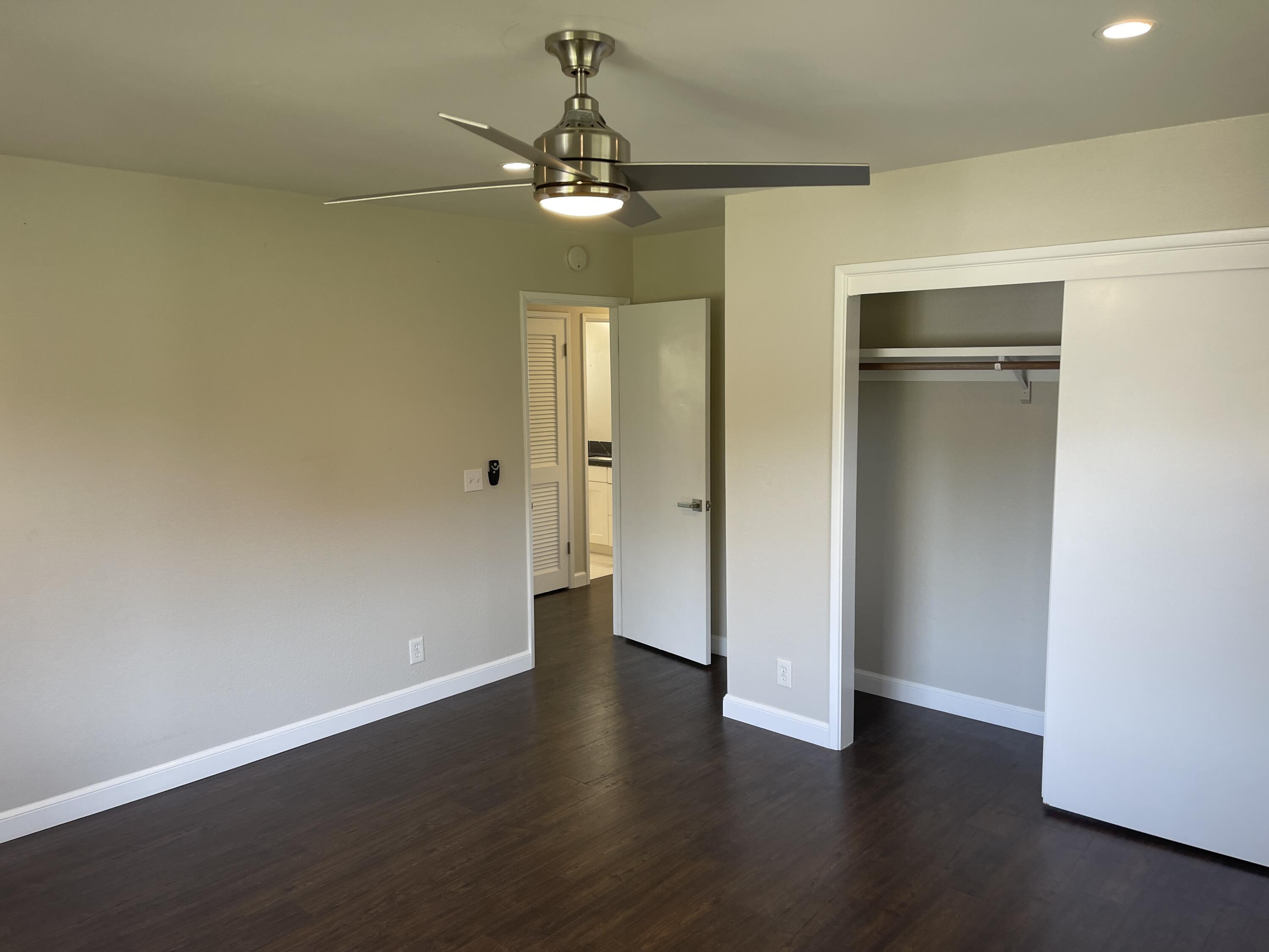 2019 Castillo Street Santa Barbara, CA 93105 - Photo 14 of 24 an empty room with wooden floor closet and windows