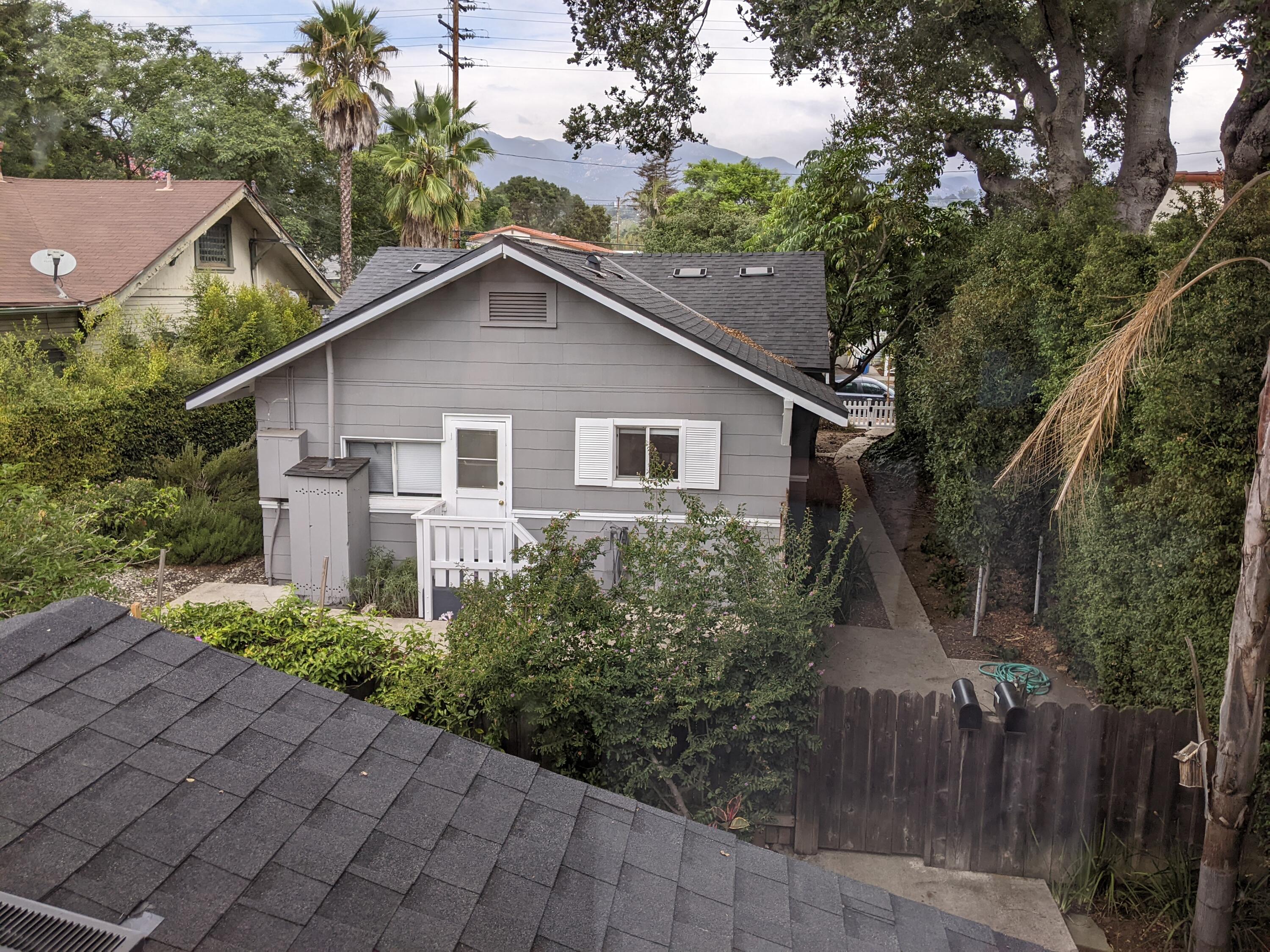 2019 Castillo Street Santa Barbara, CA 93105 - Photo 22 of 24 a view of a yard in front of a house with a large tree and plants