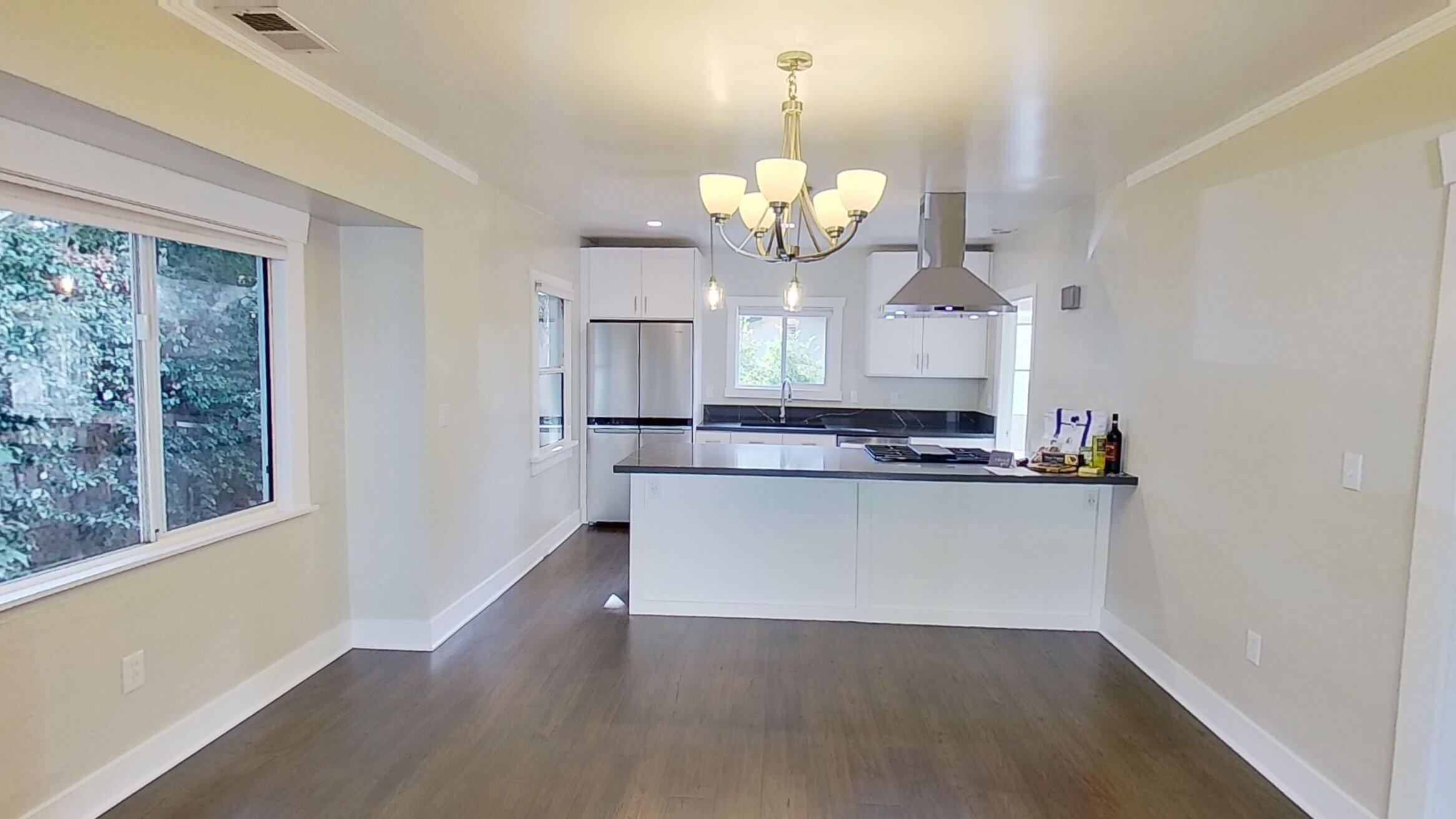 2019 Castillo Street Santa Barbara, CA 93105 - Photo 10 of 24 a view of a kitchen with a dishwasher wooden floor and a window