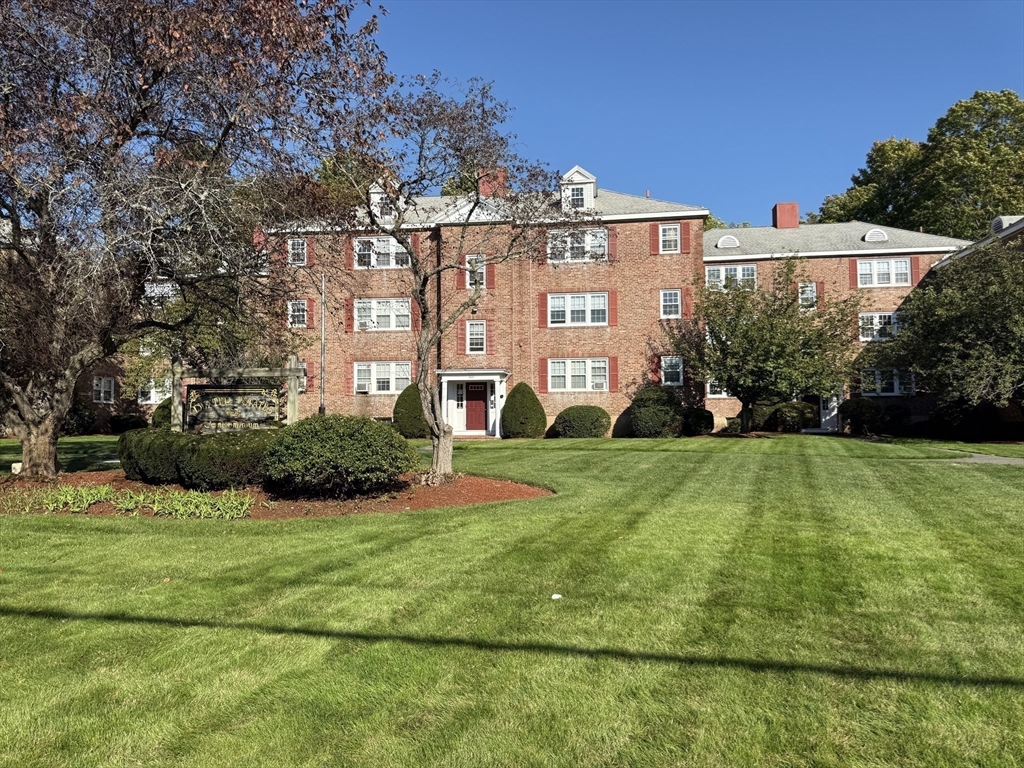 1 Dexter Street, Unit 5 Malden, MA 02148 - Photo 14 of 17 a view of a big building with big yard and large trees