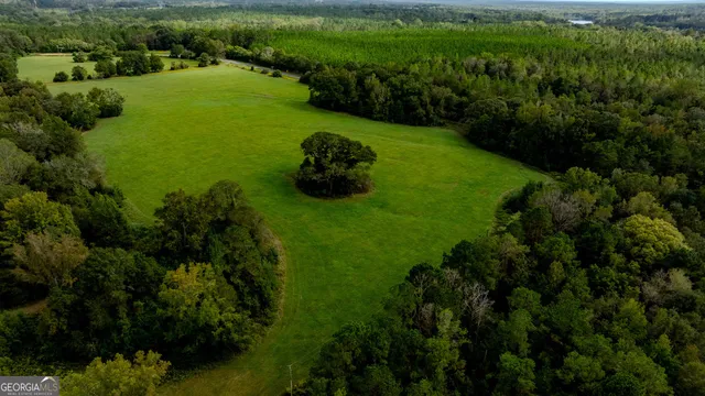 a view of a lake with a yard