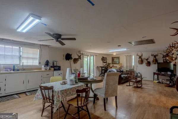a view of a dining room with furniture and chandelier