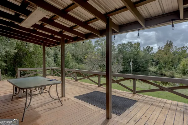 a view of a balcony with furniture