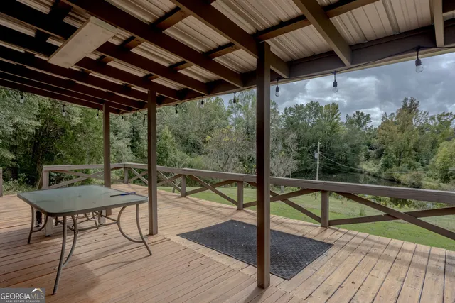 a view of a balcony with furniture