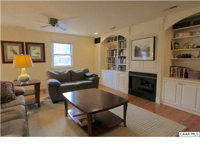 2608 Huntington Road Charlottesville, VA 22901 - Photo 3 of 22 a living room with furniture a fireplace and a window