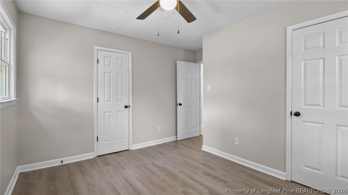 3610 Yorktown Road Hope Mills, NC 28348 - Photo 24 of 30 an empty room with ceiling fan and window