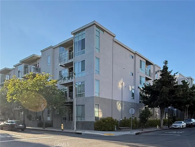a front view of a building with tree s