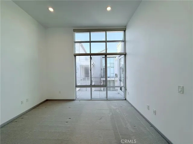 a spacious bathroom with a shower sink and mirror