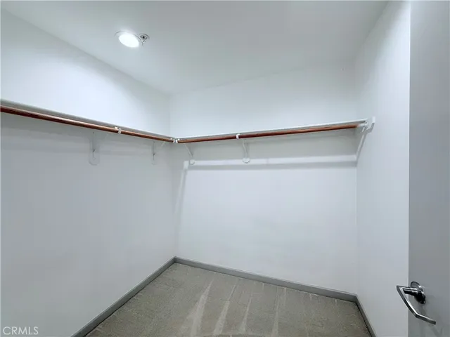 a bathroom with a double vanity sink mirror and shower