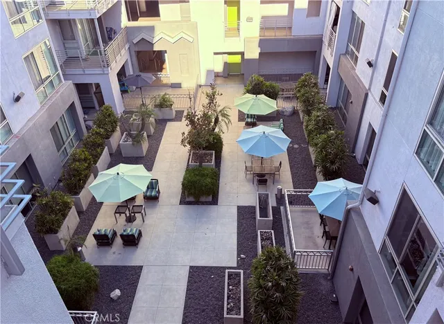 a view of a kitchen with a sink and a large window