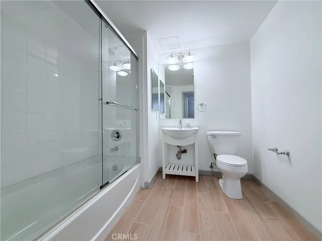 an empty room with sliding glass door