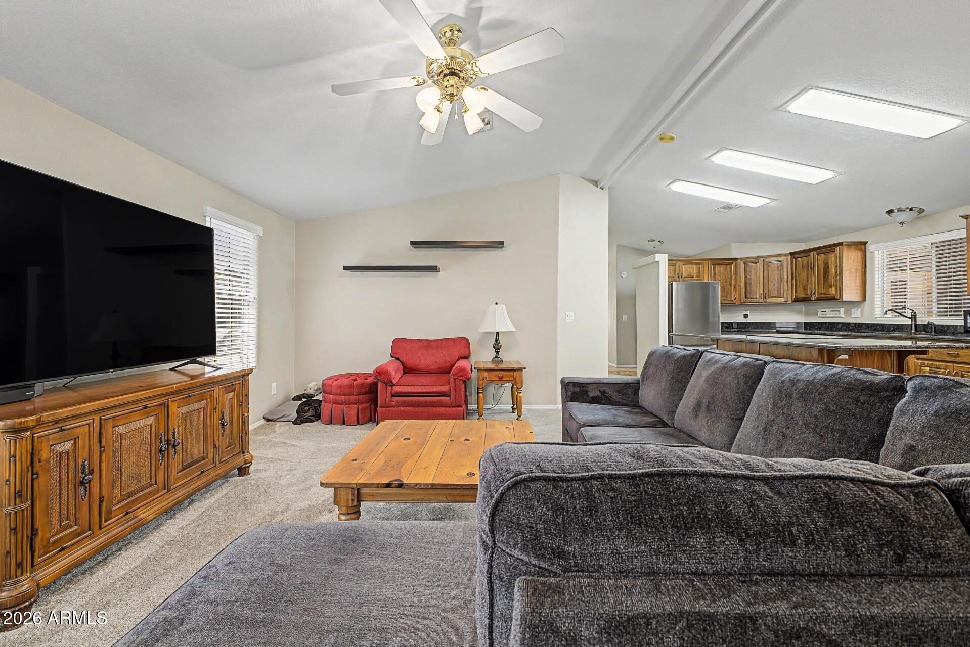 2550 South Ellsworth Road, Unit 46 Mesa, AZ 85209 - Photo 12 of 47 a living room with furniture and a flat screen tv