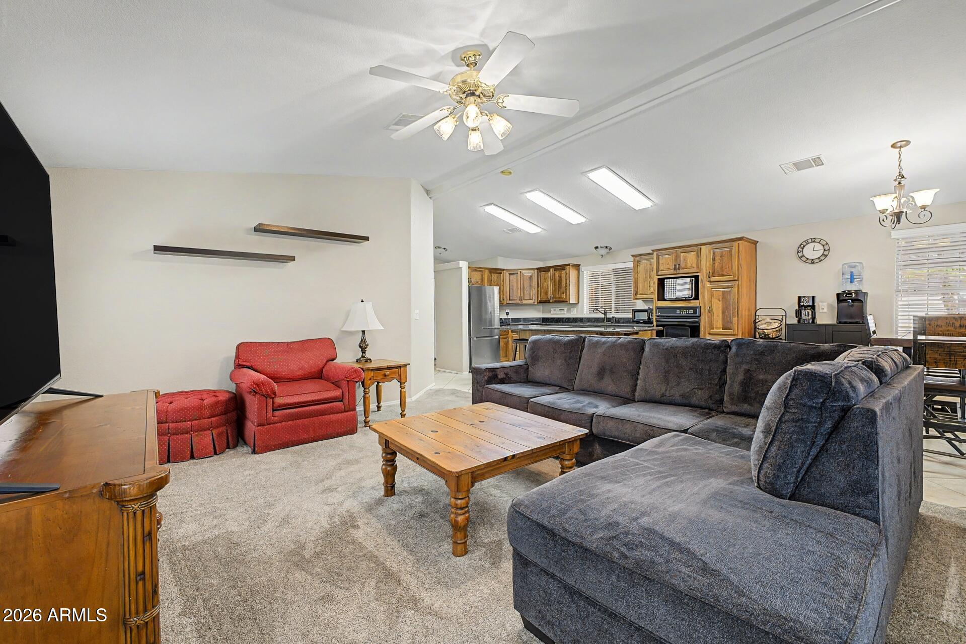 2550 South Ellsworth Road, Unit 46 Mesa, AZ 85209 - Photo 13 of 47 a living room with furniture and wooden floor