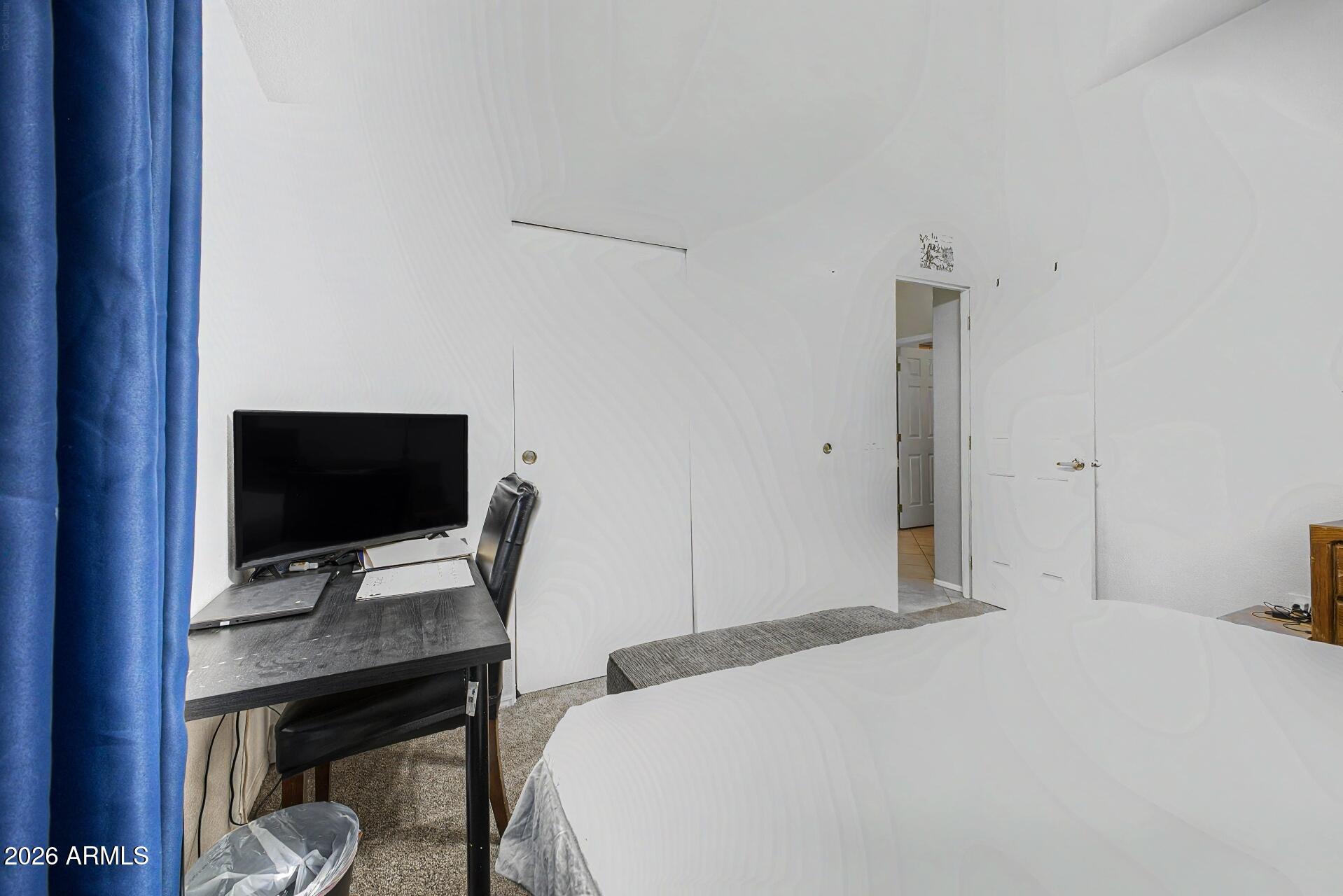 2550 South Ellsworth Road, Unit 46 Mesa, AZ 85209 - Photo 22 of 47 a bedroom with a bed and a flat screen tv