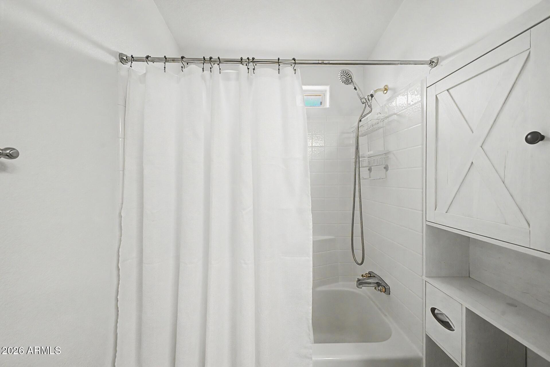 2550 South Ellsworth Road, Unit 46 Mesa, AZ 85209 - Photo 25 of 47 a bathroom with a shower and a sink