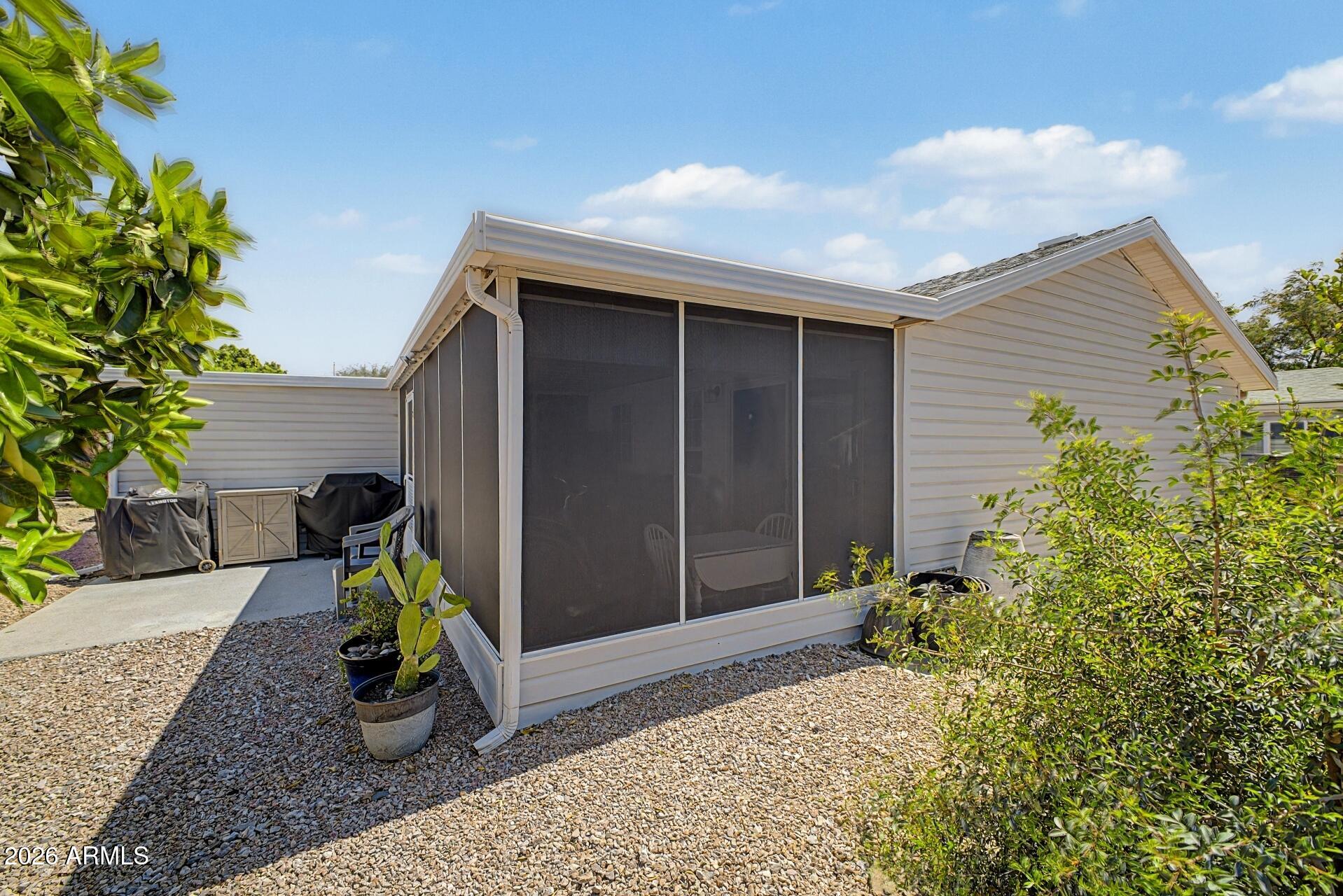 2550 South Ellsworth Road, Unit 46 Mesa, AZ 85209 - Photo 30 of 47 a view of backyard with a barn and a potted plants
