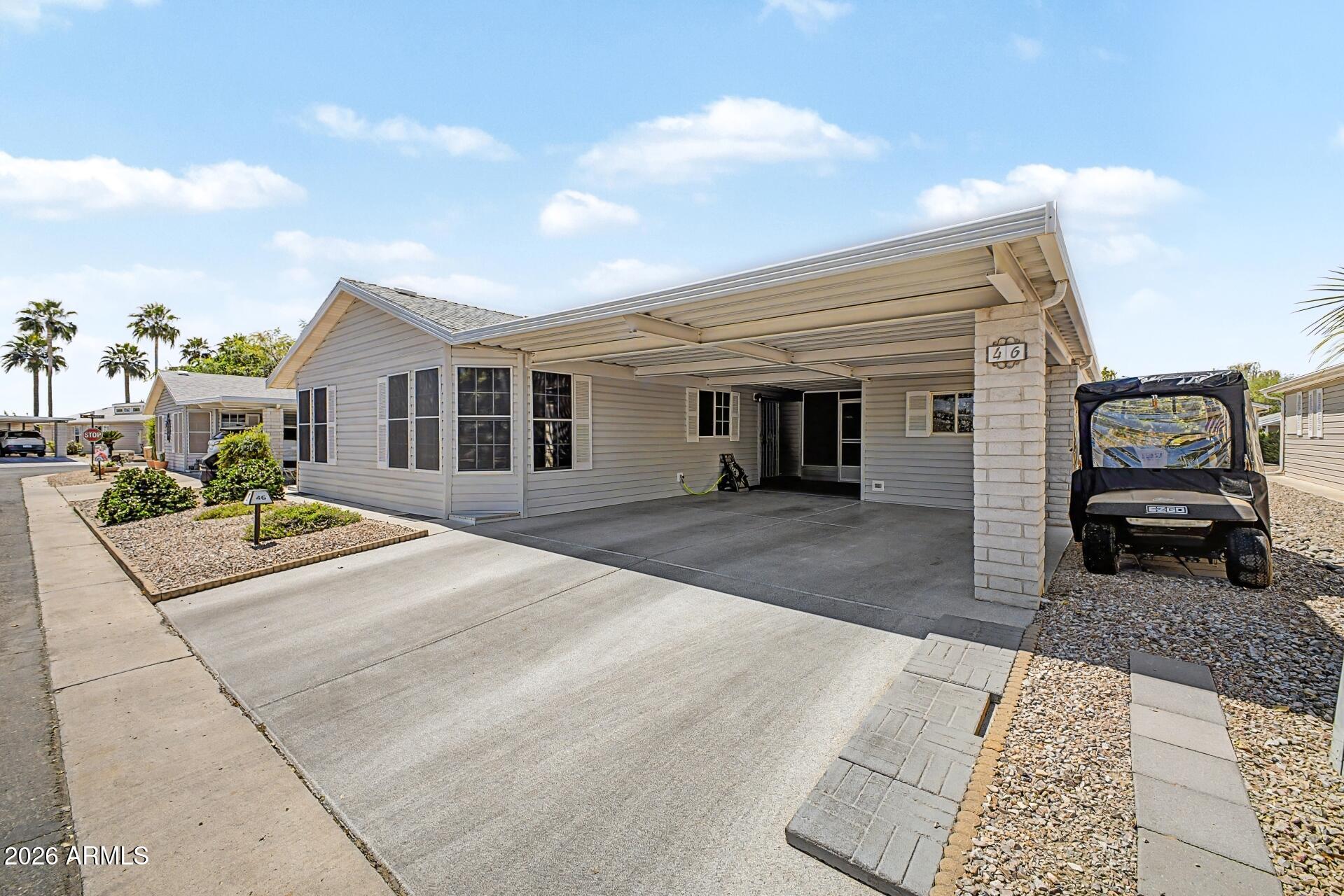 2550 South Ellsworth Road, Unit 46 Mesa, AZ 85209 - Photo 3 of 47 a front view of a house with a yard