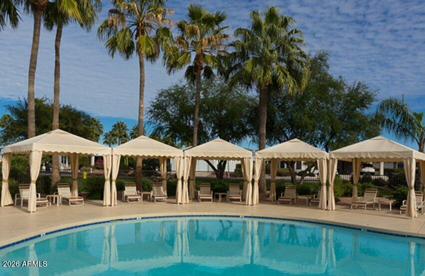 2550 South Ellsworth Road, Unit 46 Mesa, AZ 85209 - Photo 44 of 47 a front view of a house with garden and porch