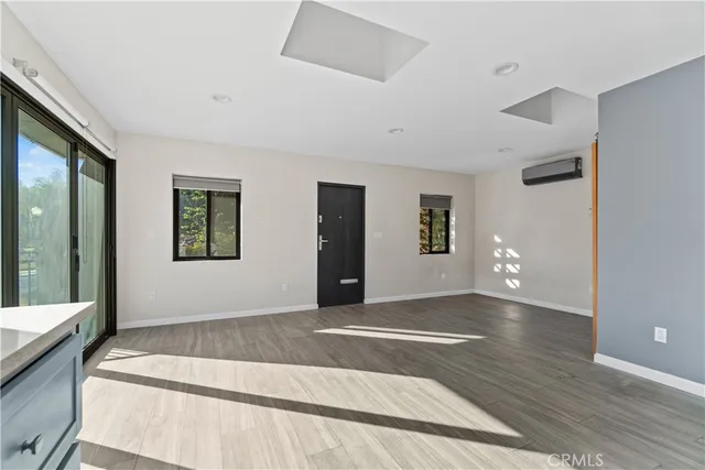 a large space with a large window and a balcony