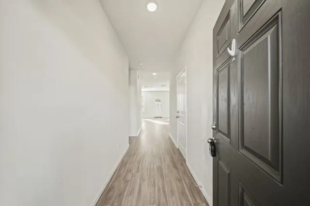 a view of a bathroom from the hallway