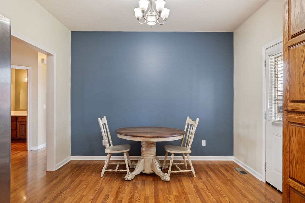 137 Piney Road Lawrenceburg, TN 38464 - Photo 15 of 33 a view of a dining room with furniture and wooden floor