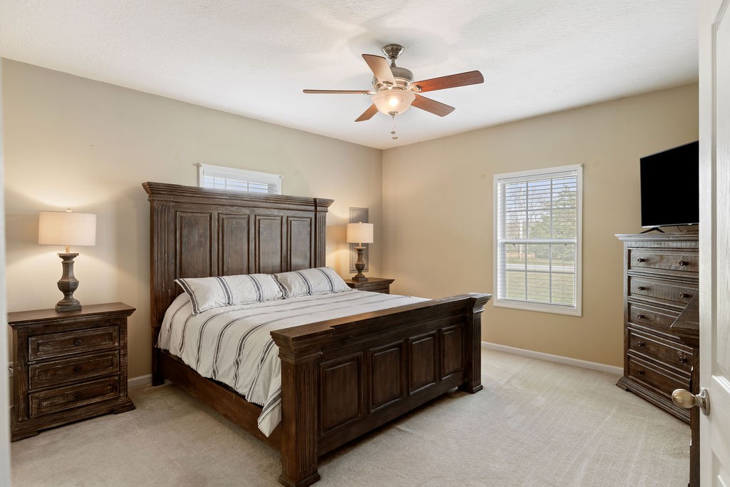 137 Piney Road Lawrenceburg, TN 38464 - Photo 16 of 33 a bedroom with a bed and a television