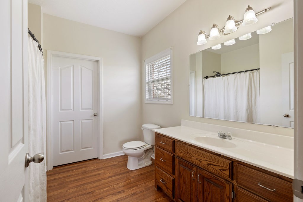 137 Piney Road Lawrenceburg, TN 38464 - Photo 18 of 33 a bathroom with a sink a toilet a mirror and shower