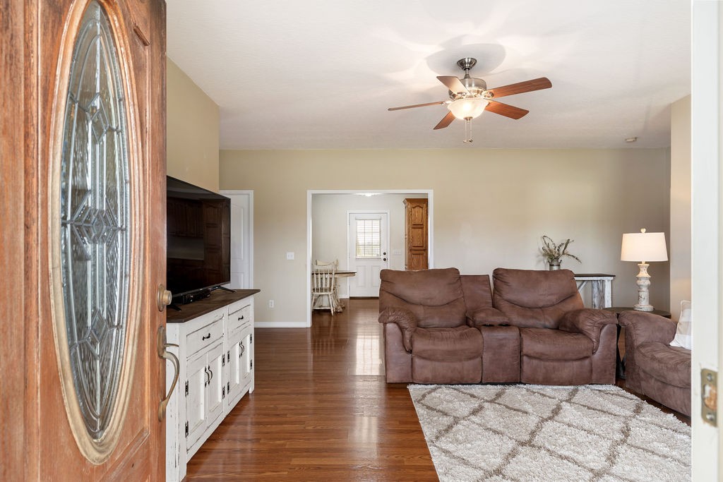 137 Piney Road Lawrenceburg, TN 38464 - Photo 8 of 33 a living room with furniture and a flat screen tv