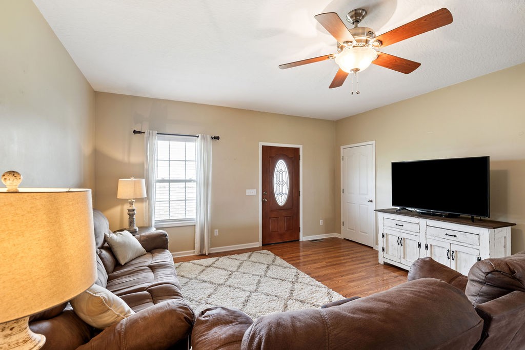 137 Piney Road Lawrenceburg, TN 38464 - Photo 9 of 33 a bedroom with furniture and a flat screen tv