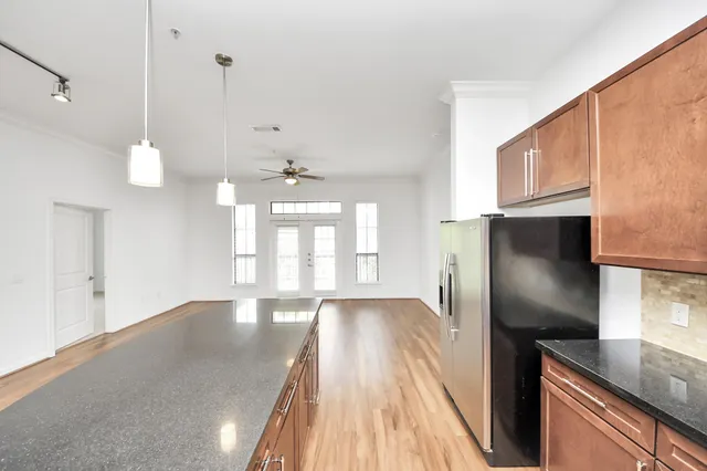 a view of a kitchen with a sink and dishwasher wooden floor