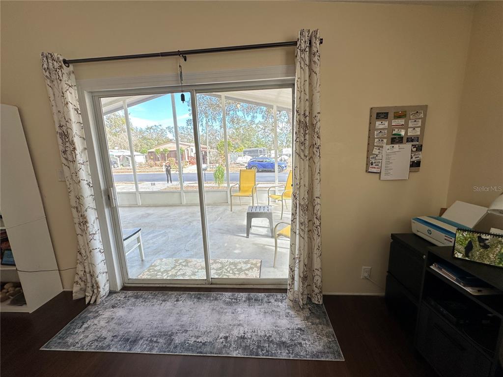 16735 Olivaud Street Hudson, FL 34667 - Photo 24 of 53 a view of an empty room with wooden floor and a window