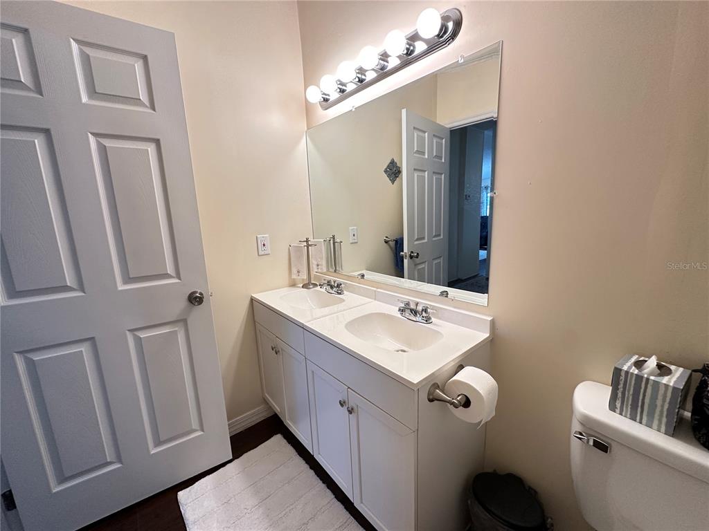 16735 Olivaud Street Hudson, FL 34667 - Photo 26 of 53 a bathroom with a double vanity sink mirror and