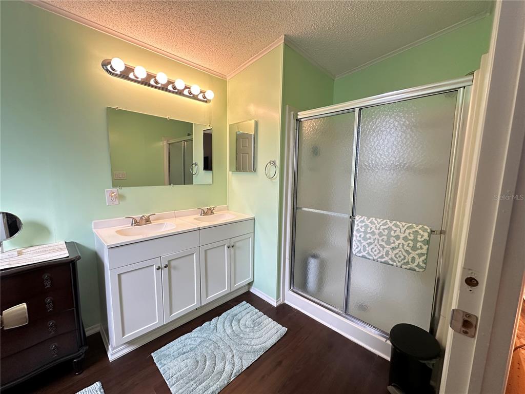 16735 Olivaud Street Hudson, FL 34667 - Photo 42 of 53 a bathroom with a double vanity sink and mirror