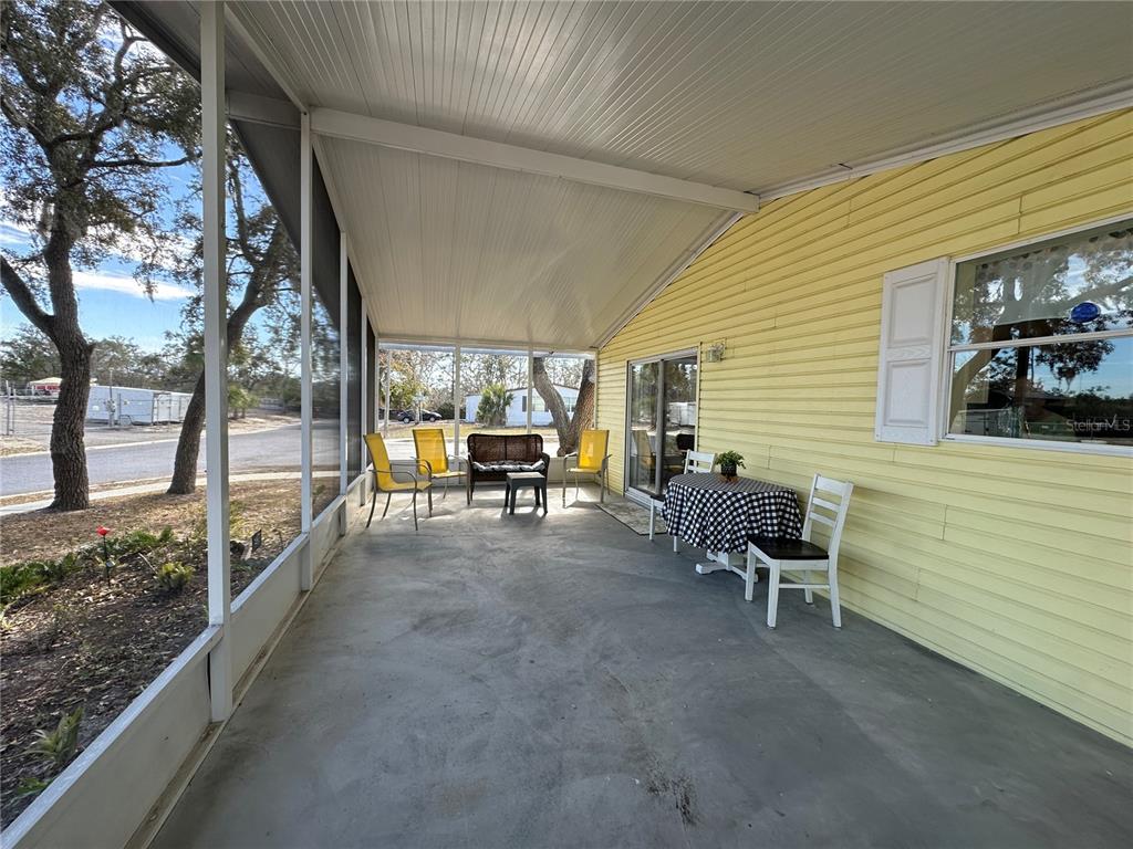 16735 Olivaud Street Hudson, FL 34667 - Photo 53 of 53 a view of a porch with furniture and a yard