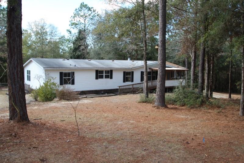 6019 Gagnon Road Crestview, FL 32539 - Photo 1 of 36 front view of a house with a yard