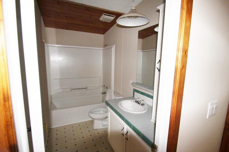 6019 Gagnon Road Crestview, FL 32539 - Photo 13 of 36 a bathroom with a granite countertop sink toilet and shower