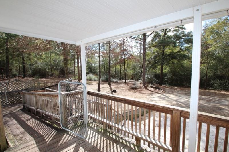 6019 Gagnon Road Crestview, FL 32539 - Photo 18 of 36 a view of a chair and tables in the balcony