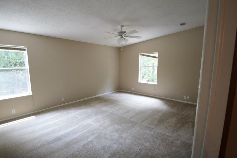 6019 Gagnon Road Crestview, FL 32539 - Photo 27 of 36 an empty room with a window and a fan