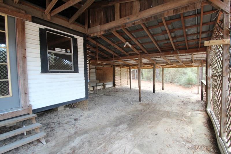 6019 Gagnon Road Crestview, FL 32539 - Photo 10 of 36 a view of a room with wooden walls