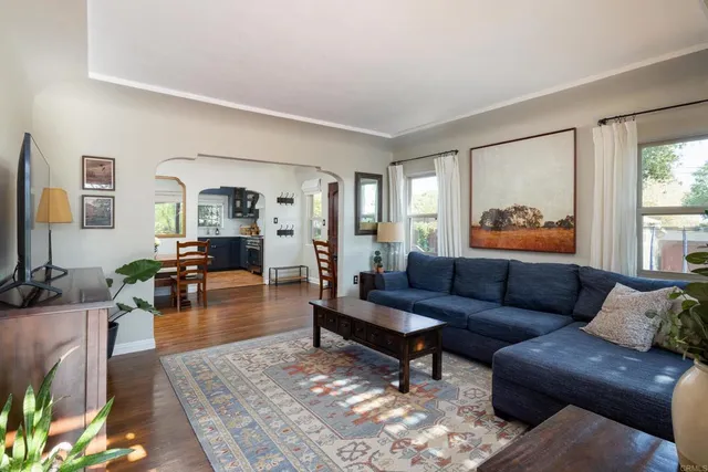a living room with furniture and a table