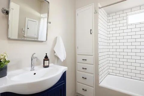 a bathroom with a bathtub and a shower