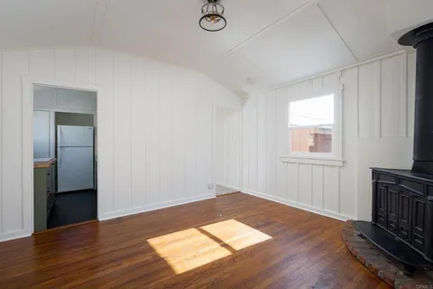 a kitchen with a stove and cabinets