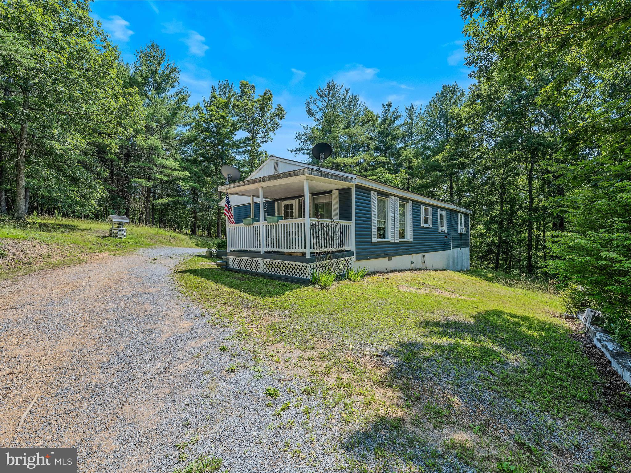 378 Oak Hill Road Berkeley Springs, WV 25411 - Photo 51 of 57 a view of a house with a yard