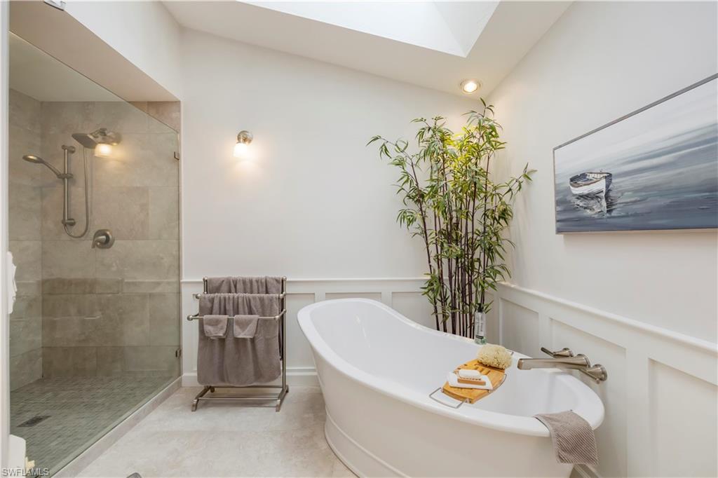 5520 Cynthia Lane Naples, FL 34112 - Photo 12 of 32 a bathroom with a tub and sink